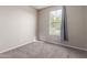Bright bedroom with neutral walls, soft carpet, and a window providing natural light at 4050 W Coles Rd, Laveen, AZ 85339