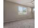 Neutral bedroom features neutral paint, carpet, and ample natural light at 4050 W Coles Rd, Laveen, AZ 85339