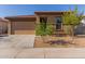 Charming single story home featuring low maintenance landscaping and a two car garage at 4050 W Coles Rd, Laveen, AZ 85339