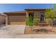 Charming single story home featuring low maintenance landscaping and a two car garage at 4050 W Coles Rd, Laveen, AZ 85339