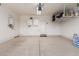 Spacious garage with ample storage options, including overhead racks and wall-mounted cabinets at 4050 W Coles Rd, Laveen, AZ 85339