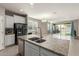 Bright kitchen featuring an island with granite countertops and stainless steel appliances at 4050 W Coles Rd, Laveen, AZ 85339