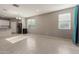 View of a spacious living room with neutral paint and lots of natural light at 4050 W Coles Rd, Laveen, AZ 85339