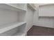 Spacious walk-in closet with built-in shelving and ample hanging space offers optimal storage solutions at 4050 W Coles Rd, Laveen, AZ 85339