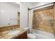Charming bathroom features a granite countertop vanity and a tiled shower-tub combination for a relaxing experience at 4411 N 24Th Way, Phoenix, AZ 85016