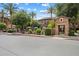 Exterior view of gated community with lush landscaping, pool, and desert-style architecture at 4411 N 24Th Way, Phoenix, AZ 85016