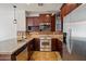 Well-equipped kitchen with stainless steel appliances and tile backsplash at 4411 N 24Th Way, Phoenix, AZ 85016
