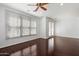 Spacious living area with hardwood floors and access to a balcony at 4411 N 24Th Way, Phoenix, AZ 85016