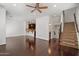 Open living area with hardwood floors, staircase and adjacent kitchen at 4411 N 24Th Way, Phoenix, AZ 85016