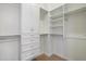 Organized walk-in closet with built-in shelving, drawers, and ample hanging space for efficient storage at 4411 N 24Th Way, Phoenix, AZ 85016