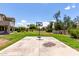 Private backyard featuring a basketball court surrounded by mature trees and landscaping at 4490 S Rio Dr, Chandler, AZ 85249
