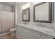 Bathroom with double vanity and tiled shower at 4490 S Rio Dr, Chandler, AZ 85249