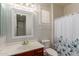 Bathroom featuring window shutter, mirror and shower at 4490 S Rio Dr, Chandler, AZ 85249