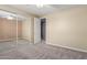 Bright bedroom featuring neutral carpet, ceiling fan and mirrored closet at 4490 S Rio Dr, Chandler, AZ 85249