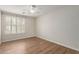 Bedroom featuring wood floors and window shutters at 4490 S Rio Dr, Chandler, AZ 85249