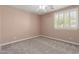 Bedroom featuring neutral carpet and window shutters at 4490 S Rio Dr, Chandler, AZ 85249