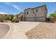 Charming two-story home featuring a three car garage, stone accents, and lovely landscaping at 4490 S Rio Dr, Chandler, AZ 85249
