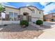 Charming two-story home featuring a three car garage, stone accents, and lovely landscaping at 4490 S Rio Dr, Chandler, AZ 85249