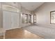 Inviting foyer featuring tiled floors, grand double doors, and large windows at 4490 S Rio Dr, Chandler, AZ 85249