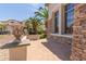 Inviting front yard showcasing stone accents and a lovely patio at 4490 S Rio Dr, Chandler, AZ 85249