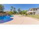 Lush backyard features a sparkling swimming pool and a spacious deck, creating an inviting outdoor oasis at 4490 S Rio Dr, Chandler, AZ 85249