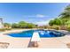 A refreshing pool with diving board creates a fun backyard oasis for outdoor enjoyment and entertainment at 4490 S Rio Dr, Chandler, AZ 85249