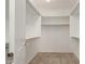 Walk-in closet featuring built-in shelving and carpet at 4490 S Rio Dr, Chandler, AZ 85249