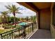 Balcony view overlooking lush landscaping, a community pool, and inviting lounge areas at 4777 S Fulton Ranch Blvd # 1024, Chandler, AZ 85248