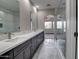 Contemporary bathroom featuring a dual sink vanity, arched entry and a glass enclosed shower at 4777 S Fulton Ranch Blvd # 1024, Chandler, AZ 85248