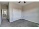 Neutral bedroom featuring a ceiling fan, and gray carpet with closet with sliding doors at 4777 S Fulton Ranch Blvd # 1024, Chandler, AZ 85248