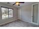 Peaceful bedroom with a window view, wood-look tile flooring, and ample natural light at 4777 S Fulton Ranch Blvd # 1024, Chandler, AZ 85248