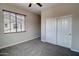 Bedroom featuring a window with wood blinds, neutral walls, ceiling fan and gray carpet at 4777 S Fulton Ranch Blvd # 1024, Chandler, AZ 85248