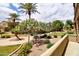 Common area featuring tropical trees, green grass, and walking paths at 4777 S Fulton Ranch Blvd # 1024, Chandler, AZ 85248