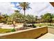 Common area featuring tropical trees, green grass, and walking paths at 4777 S Fulton Ranch Blvd # 1024, Chandler, AZ 85248