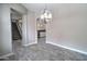 View from dining room showing open concept living, stairs, and kitchen with white cabinets at 4777 S Fulton Ranch Blvd # 1024, Chandler, AZ 85248