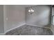 Dining room with wood-look tile flooring, modern light fixture and neutral walls at 4777 S Fulton Ranch Blvd # 1024, Chandler, AZ 85248