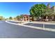 Community entrance with stone accents, a tile roof, and ample parking space at 4777 S Fulton Ranch Blvd # 1024, Chandler, AZ 85248