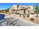 Charming home with a desert landscape, neutral stucco, and stone accents on a sunny day at 4777 S Fulton Ranch Blvd # 1024, Chandler, AZ 85248