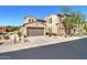 Two-story house featuring a two car garage, neutral stucco, and stone accents at 4777 S Fulton Ranch Blvd # 1024, Chandler, AZ 85248