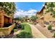 Inviting walkway through lush green space with mature trees and beautiful landscaping between buildings at 4777 S Fulton Ranch Blvd # 1024, Chandler, AZ 85248