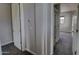 Hallway with gray carpet leading to bedrooms with doors and views into the rooms at 4777 S Fulton Ranch Blvd # 1024, Chandler, AZ 85248