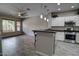 Bright kitchen featuring white cabinetry, stainless steel appliances, and an open floor plan at 4777 S Fulton Ranch Blvd # 1024, Chandler, AZ 85248