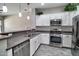 Modern kitchen featuring white cabinets, stainless steel appliances, and a gray countertop at 4777 S Fulton Ranch Blvd # 1024, Chandler, AZ 85248