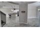 Open-concept living area boasts wood-look tile flooring and leads to a kitchen with a breakfast bar at 4777 S Fulton Ranch Blvd # 1024, Chandler, AZ 85248