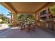 Outdoor kitchen with built-in barbecue and communal table for casual outdoor dining and gatherings at 4777 S Fulton Ranch Blvd # 1024, Chandler, AZ 85248