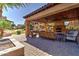 Comfortable outdoor lounge area with a fireplace and plush seating, ideal for relaxation and entertaining at 4777 S Fulton Ranch Blvd # 1024, Chandler, AZ 85248