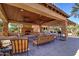 Inviting outdoor lounge with stone fireplace and seating, perfect for enjoying the community's amenities at 4777 S Fulton Ranch Blvd # 1024, Chandler, AZ 85248