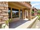 Patio featuring columns, stucco wall, and door access to a home's backyard at 4777 S Fulton Ranch Blvd # 1024, Chandler, AZ 85248