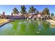 Fulton Ranch community pond with rock waterfall feature and lush landscaping at 4777 S Fulton Ranch Blvd # 1024, Chandler, AZ 85248