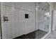 Elegant shower featuring subway tiles, dark tile floor, and glass doors at 4777 S Fulton Ranch Blvd # 1024, Chandler, AZ 85248